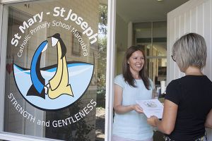 St Mary - St Joseph Catholic Primary School Maroubra - staff giving school information to parent