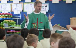 St Mary - St Joseph Catholic Primary School Maroubra - Father Kelvin conducting a mass in class